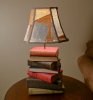 f3bff89902cb57c660c80069459e53bd--stack-of-books-book-lamps.jpg