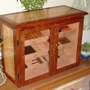 First humidor I made, now owned by Sauztime.  It's Honduran Mahogany with Birdseye Maple sides and top.  All cedar lined with cedar shelves.  Hated to see it go, but I had no use for it anymore and I felt good about it knowing it went to a good home.