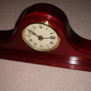 A solid purple heart wood tambour clock I made for Linda.  I do not recommend working with this devil's wood, will never work with it again, and am glad this damn thing is done!