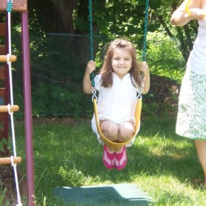 Ava on swings