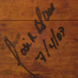 La Aurora President Jose Blanco's signature on a wooden cigar press.