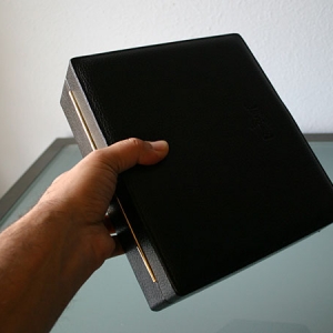 Leather travel humidor, in hand for size reference.