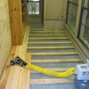 Nailing down T&G flooring with 2.5" 15ga galvanized trim nails.