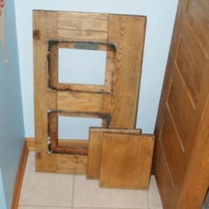 Ice Box Top Dis-assembled.  The two smaller pieces of oak were covering the two holes in the top itself as some form of decoration.  This is where I might replace with glass, or remove the center part for one larger opening.  Or I might return it to its orginal form.