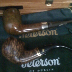 My trusty Peterson 2009 St. Patricks's Day

and a new addition of a 2010 Father's Day Pipe from LJ Peretti's