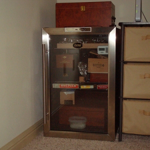 Day 1: Removed 4 wire racks and began arranging the humidors and various boxes. What a relief to see and feel the cool condition of my cigars!