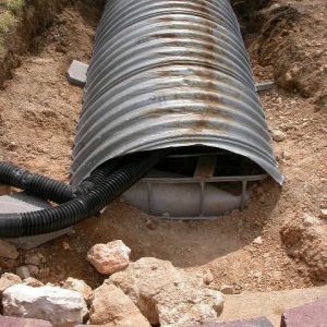 Tanks covered with steel culvert half