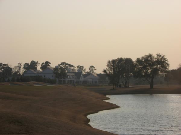 18 with the club house in the background