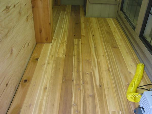 Cedar T&G flooring. I left a 1" space between the flooring and walls to allow for air flow under the floor.