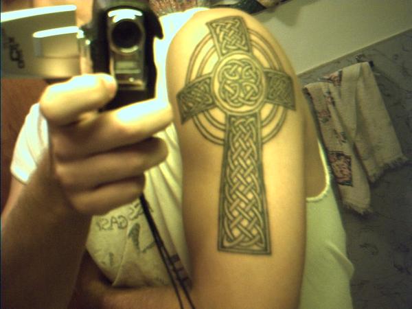 Celtic cross tattoo on my right shoulder/arm.