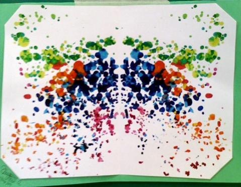 Crab figure... i think. Pieces of crayon on one half of the paper, fold, iron, and done. All melted.
ORIGINAL