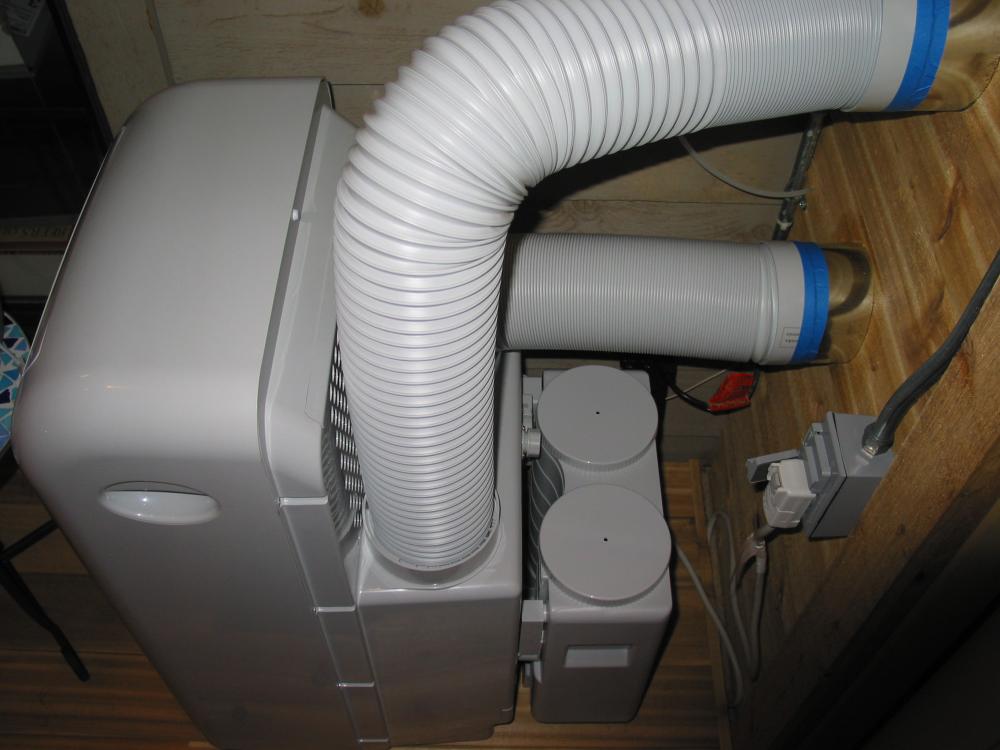 Danby A/C installation. Being self-contained, the condenser exhaust/supply is ducted in/out as a closed loop. Very nice unit, well constructed.
