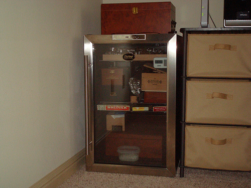 Day 1: Removed 4 wire racks and began arranging the humidors and various boxes. What a relief to see and feel the cool condition of my cigars!