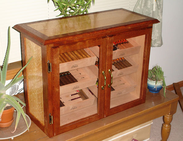 First humidor I made, now owned by Sauztime.  It's Honduran Mahogany with Birdseye Maple sides and top.  All cedar lined with cedar shelves.  Hated to see it go, but I had no use for it anymore and I felt good about it knowing it went to a good home.