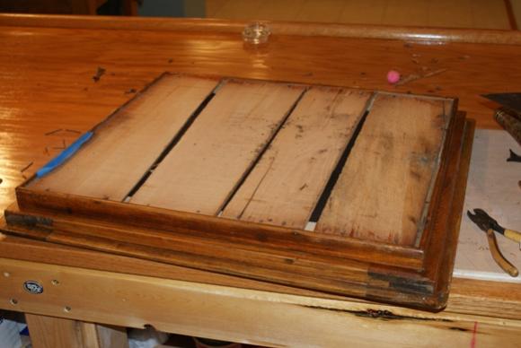 Ice Box - Back Side of Door.  I removed the lath that you see on the back of the door.  Underneath the lath was either asbestos or horsehair insulation that was sewn between two wax paper sheets.