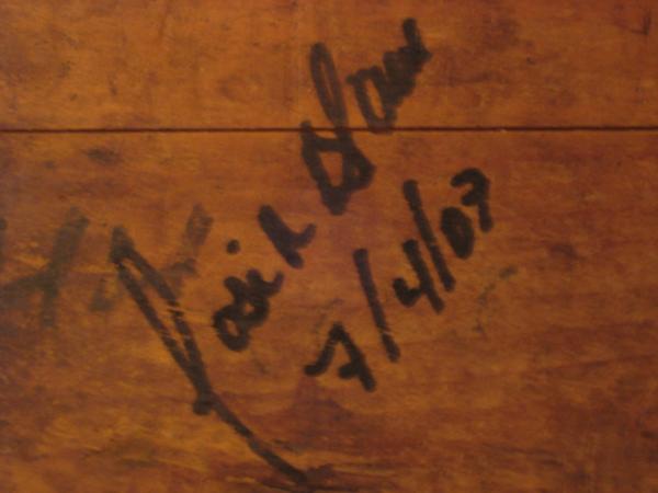La Aurora President Jose Blanco's signature on a wooden cigar press.