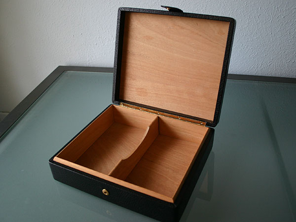 Leather travel humidor, open. Spanish cedar inside.