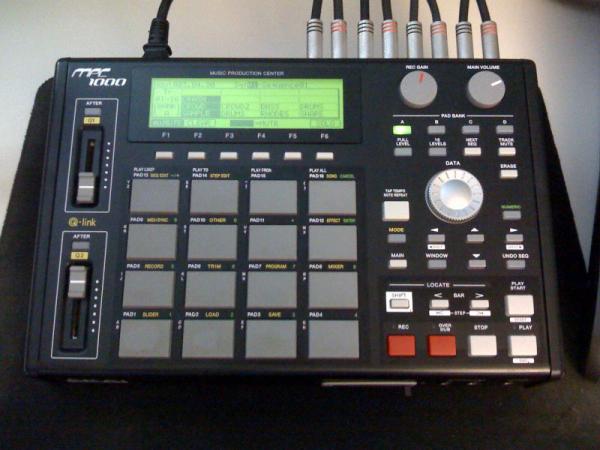 MPC 1000 -- pretty much the heart of my project studio setup. It's where I sample, play, and sequence my music. 90% of my work is done on this little box.