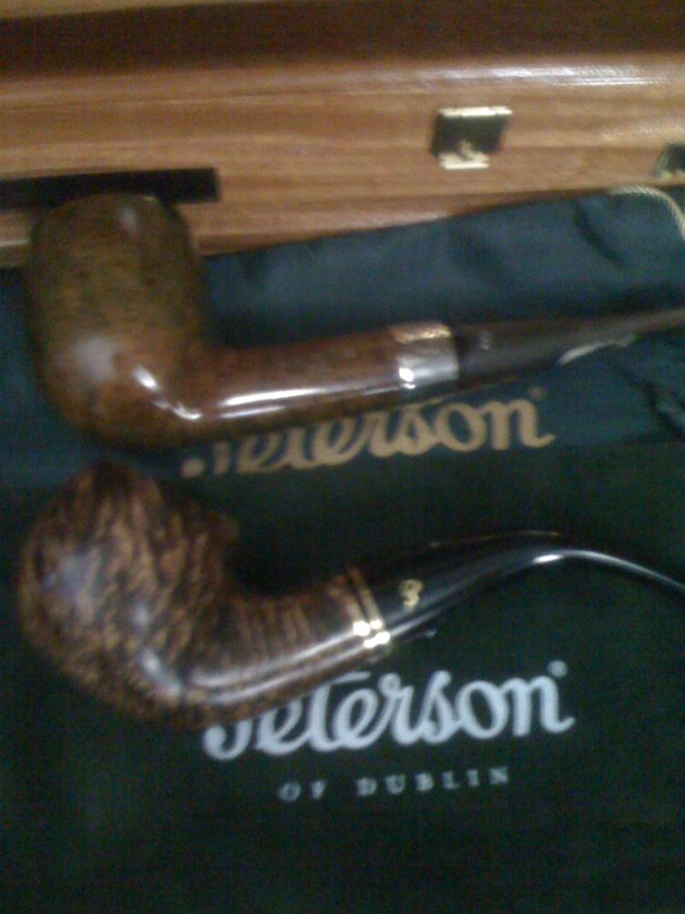 My trusty Peterson 2009 St. Patricks's Day

and a new addition of a 2010 Father's Day Pipe from LJ Peretti's