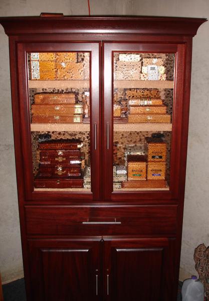 The armoire I made in 2008.  It's Mahogany with seedy glass doors on top, raised panels on the bottom.  Center drawer is for singles.  Humidification is an Accumonitor 4 canister system that works beautifully. Of course the interior is solid Spanish Cedar.