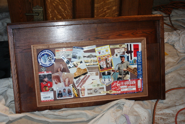 The raised center section was like that in the original ice box (without the memorabilia).  It was a drop panel that was insulated and had metal on it.