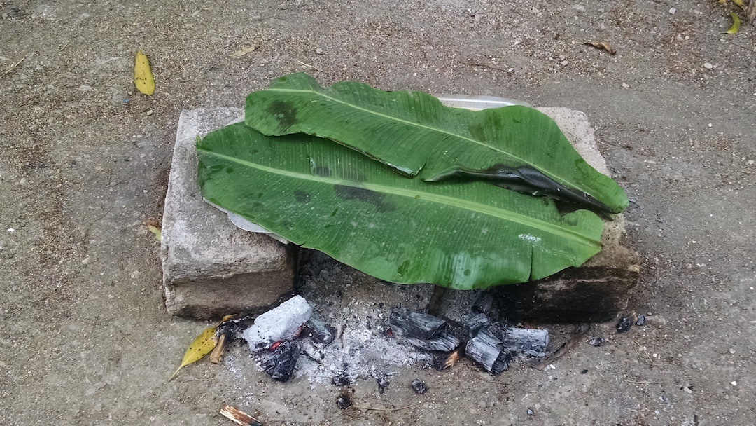 Wood Cooked Fish Covered By Banana Leaves